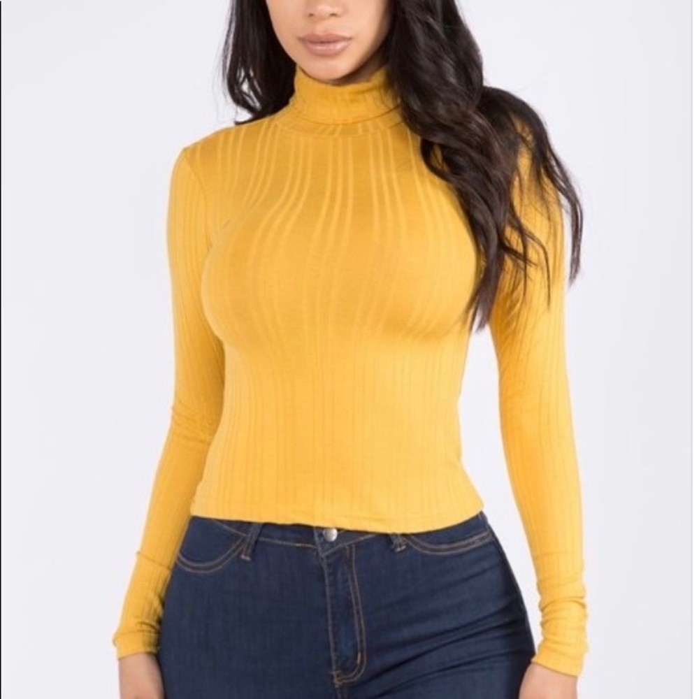 Women’s yellow ribbed turtleneck, long sleeved. Fashion Wildcat brand.